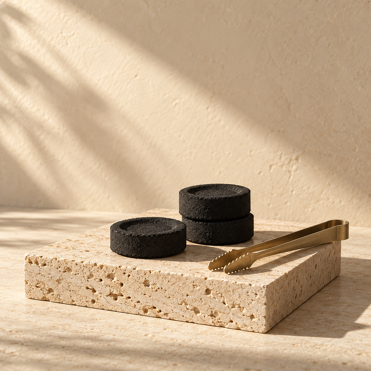 Luban House charcoal editorial still life on warm ivory stone