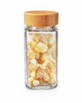 Royal Hojari frankincense resin in a clear glass jar with bamboo lid