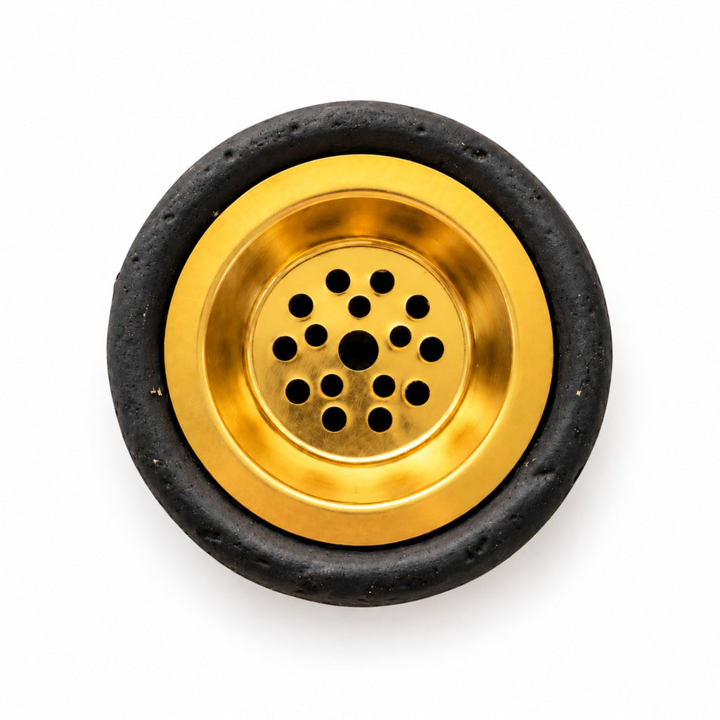 Top view of the removable gold-colored perforated metal bowl