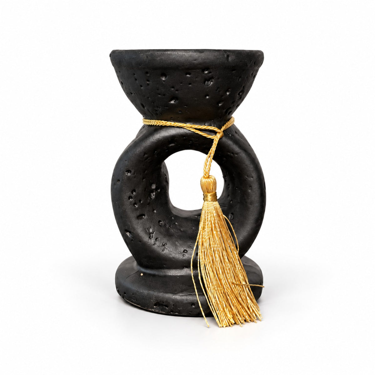 Noir Tassel incense burner showing its textured black body and decorative gold tassel