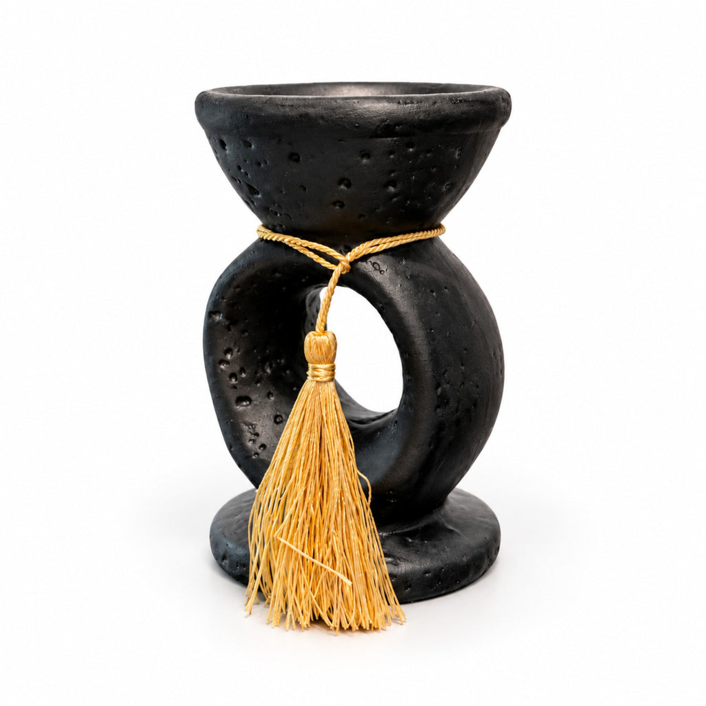 Side view of the Noir Tassel incense burner with circular open-center design