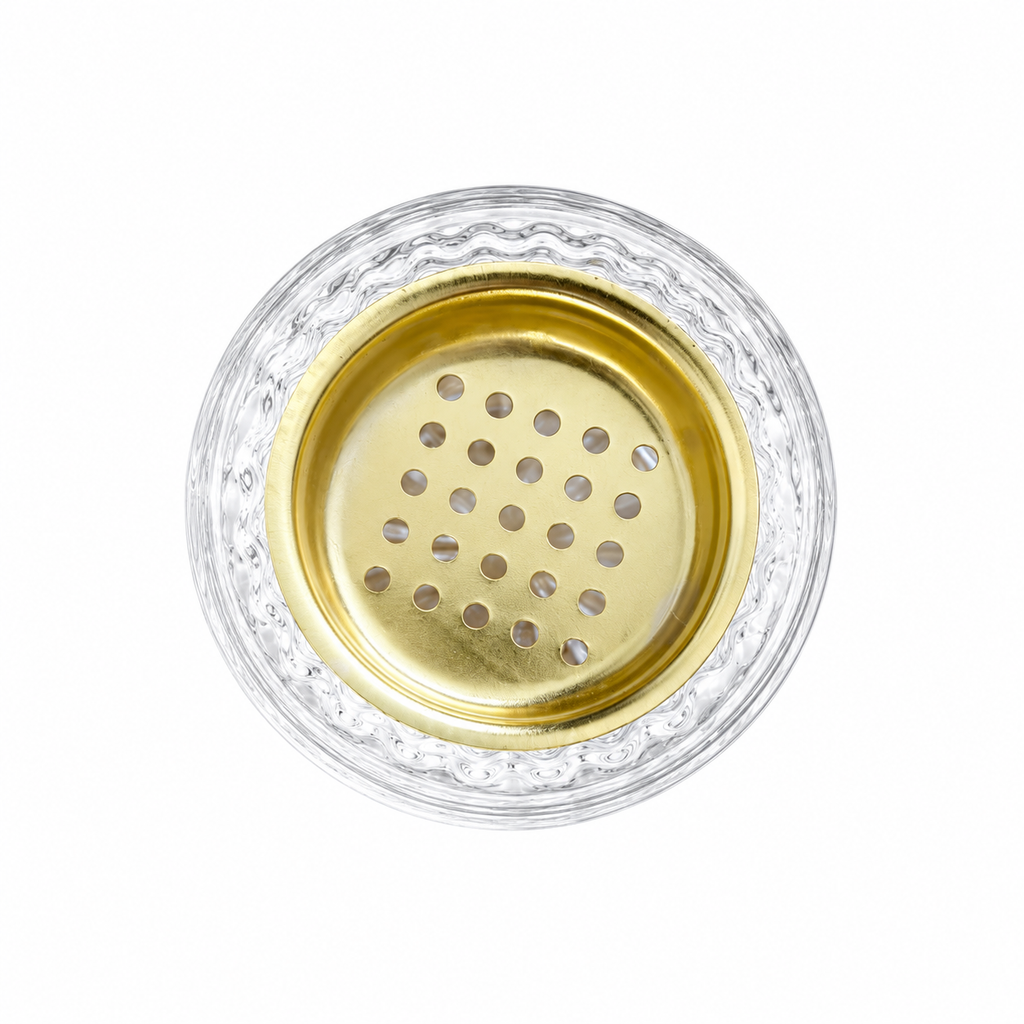 Top view of the honeycomb burner's perforated gold-toned holder